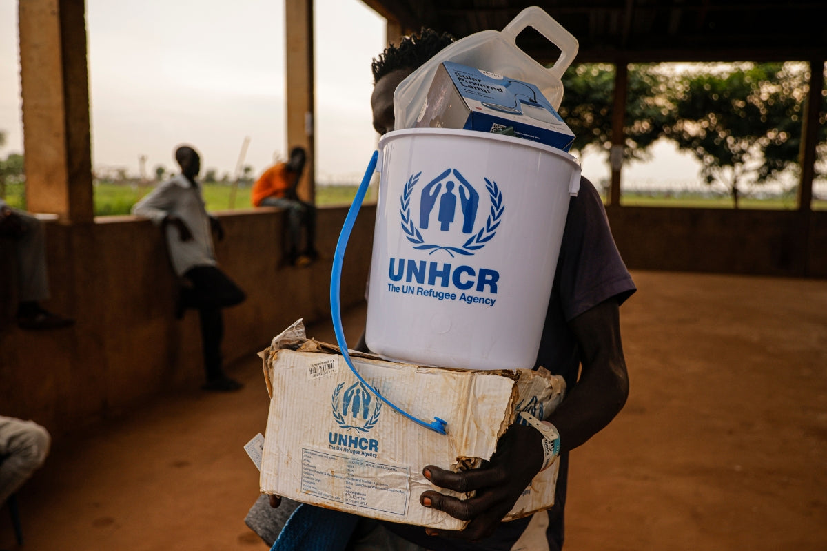 A refugee in Chad receives a UNHCR emergency survival kit