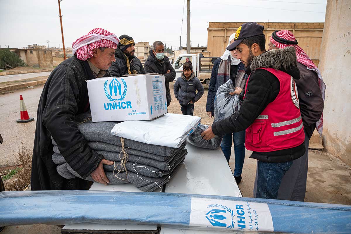 Volunteers distributing aid packages